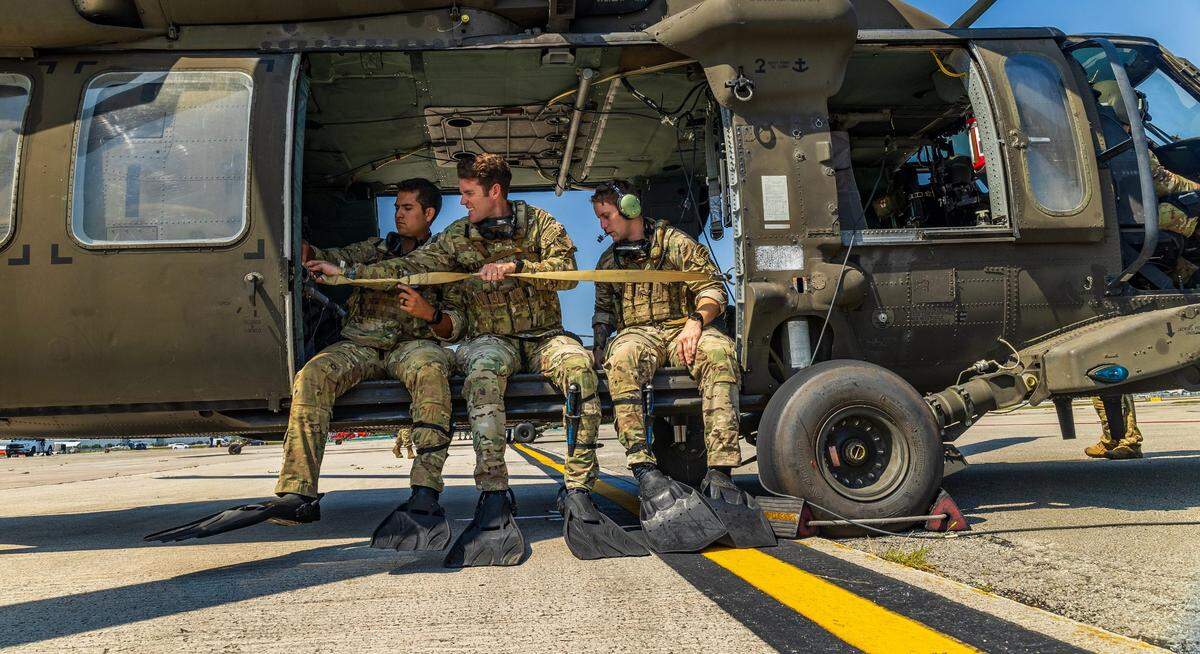 Divers with the 8-229th Assault Helicopter Battalion from Fort Knox, Kentucky, prepare to depart from the U.S. Coast Guard Air Station in Opa-locka for a training flight over South Beach. The exercise is part of preparations for the Hyundai Air & Sea Show, which returns to Miami Beach on Friday, May 23, 2025, as part of the annual National Salute to America’s Heroes.