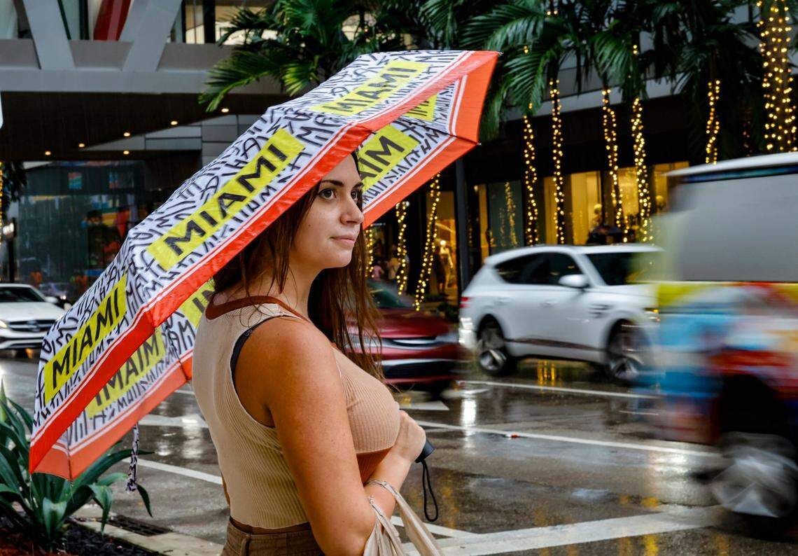 Lauren Rocchini, 29, of Brickell, waits to cross South Miami Avenue at Southwest Eighth Street at Brickell City Centre in Miami on Wednesday, Nov. 15, 2023.