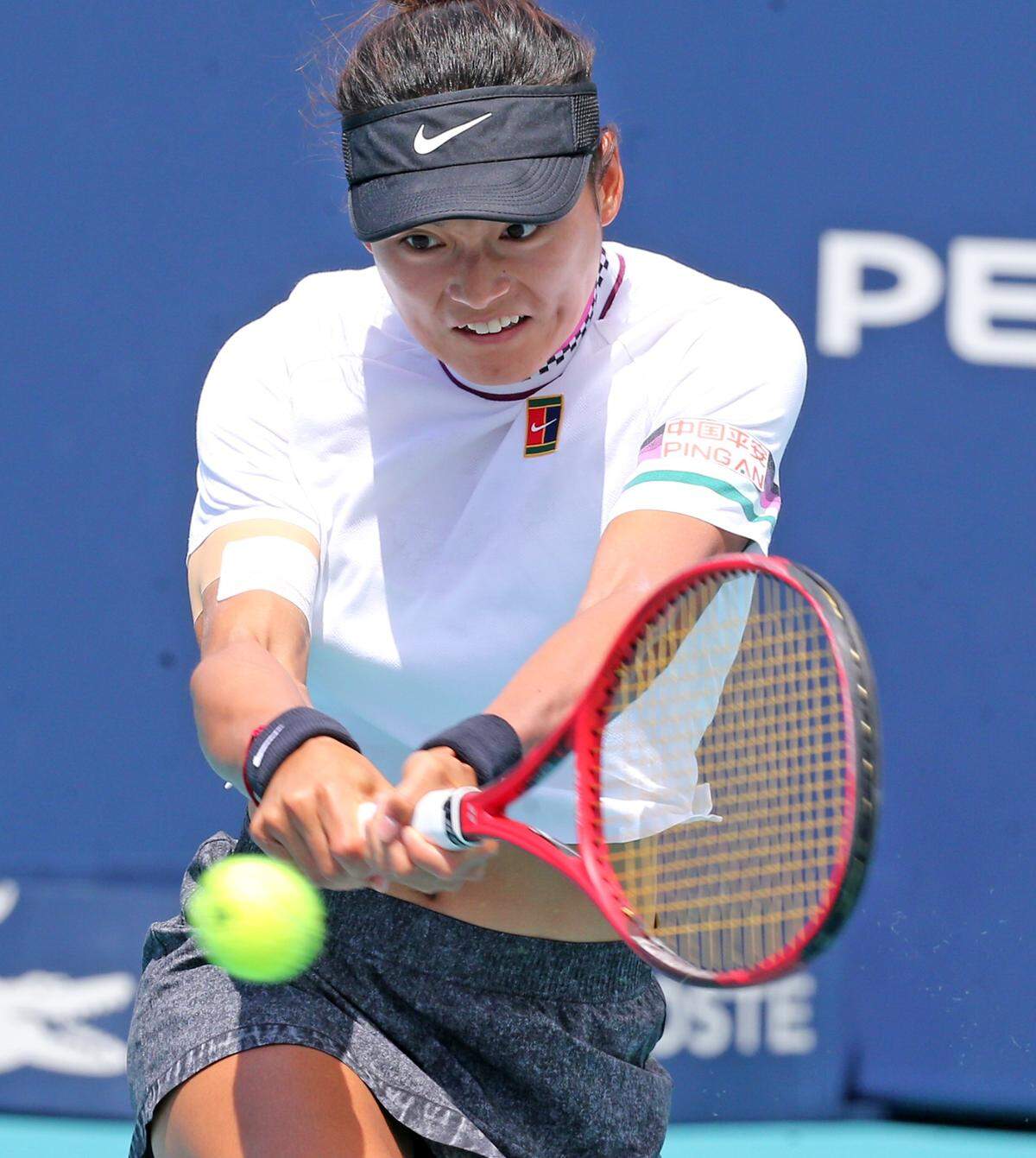 Wang Yafan returns a ball hit by Danielle Collins at the Miami Open in Miami Gardens, Florida, Sunday, March, 24, 2019.