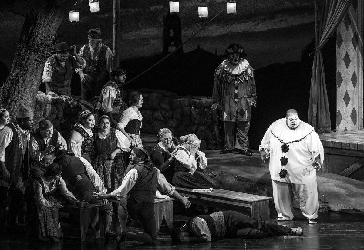 On the right Limmie Pulliam, “Canio,” stands over the body of “Silvio” after killing him (to the shock of the audience in the opera) during full rehearsal at the Adrienne Arsht Center’s Sanford and Dolores Ziff Ballet Opera House on Thursday, January 25, 2024, in Miami, Florida.