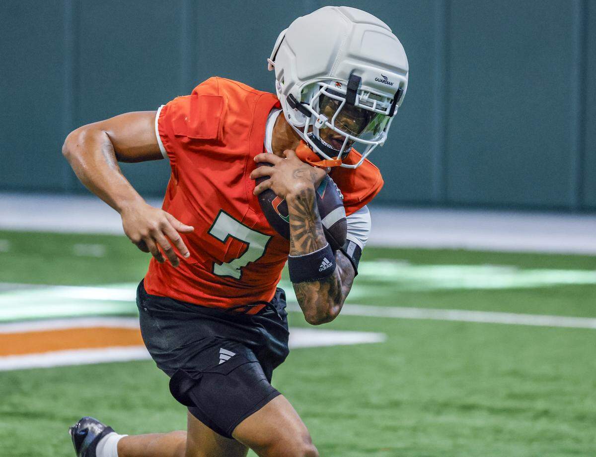 Miami Hurricanes wide receiver CJ Daniels (7) runs catching drills during football practice at the Carol Soffer Indoor Practice Facility in Coral Gables, Florida, on Thursday, July 31, 2025.