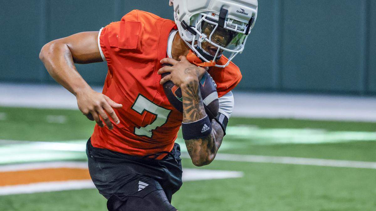 Miami Hurricanes wide receiver CJ Daniels (7) runs catching drills during football practice at the Carol Soffer Indoor Practice Facility in Coral Gables, Florida, on Thursday, July 31, 2025.