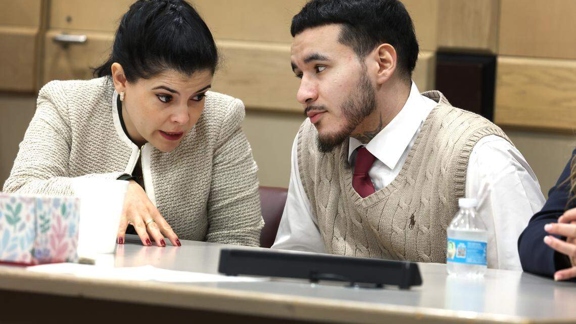 Jason Banegas, right, talks to his attorney Lien Lafargue as jurors receive deliberation instructions during his sentencing trial at the Broward County Courthouse in Fort Lauderdale, Monday, Dec. 15, 2025. Banegas pleaded guilty in October to the 2021 shooting death of Hollywood Police Officer Yandy Chirino. (Carline Jean/South Florida Sun Sentinel)