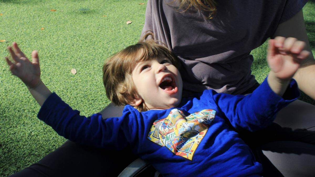 Mason Rodriguez, 3, smiles up at his mom as they play at Cypress Park in Coral Springs on Nov. 1st, 2025.  