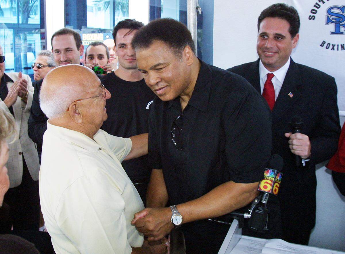 Muhammad Ali took by surprise to his former trainer Angelo Dundee during a tribute to Mr. Dundee at the former site of the 5th street gym in Miami Beach.