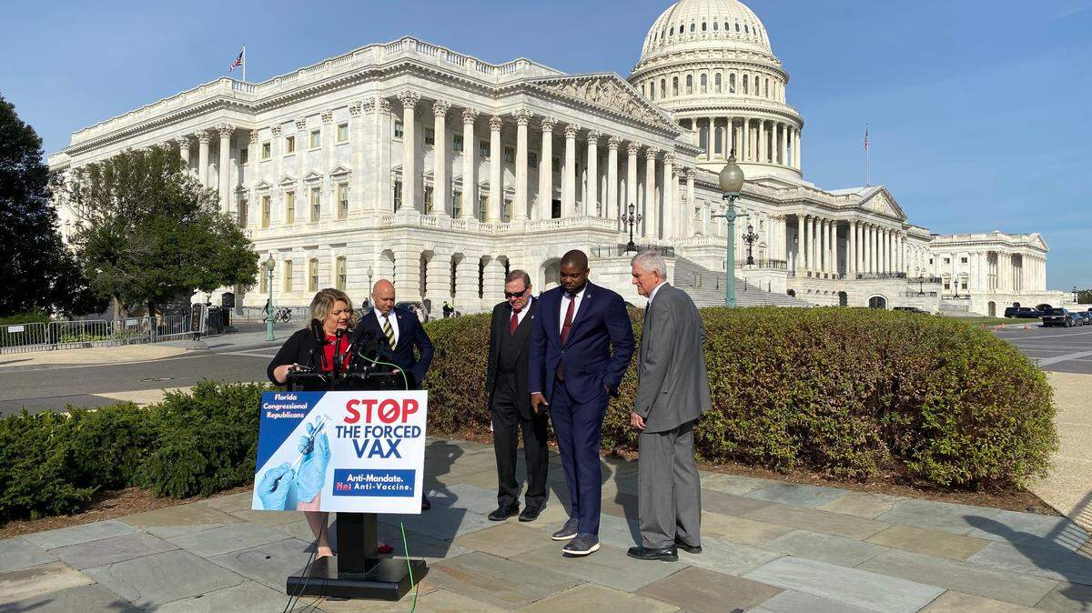 Republican U.S. Rep. Kat Cammack leads an anti-vaccine mandate press conference outside the U.S. Capitol on October 28, 2021. U.S. Reps. Brian Mast, Neal Dunn, Byron Donalds and Dan Webster stand behind Cammack.