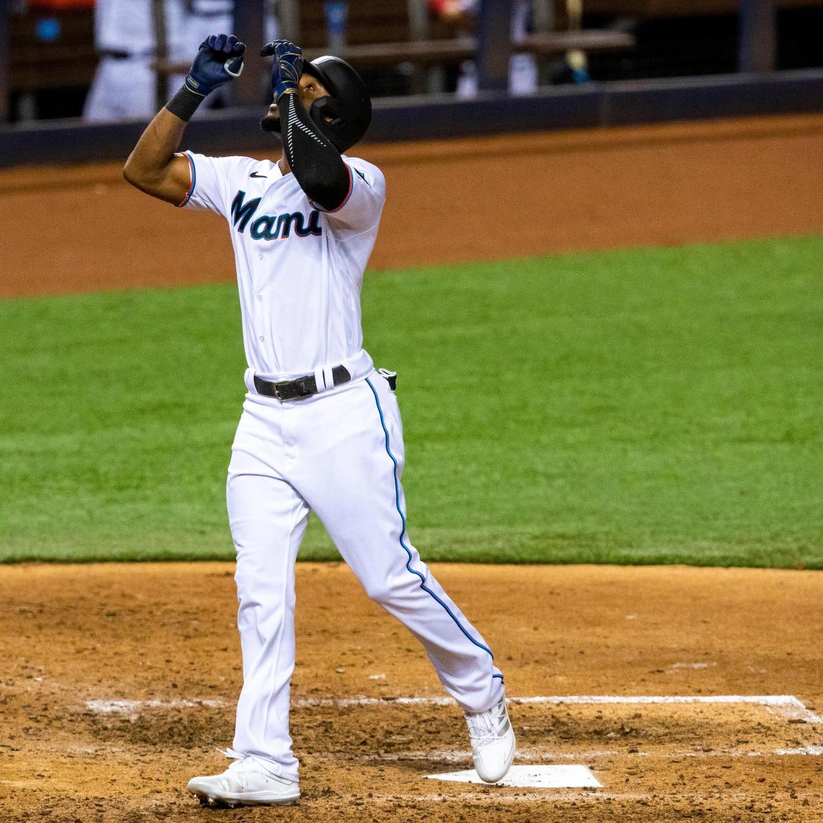 Miami Marlins outfielder Starling Marte (6) scores and crosses home plate after homering on a line drive down center field during the eighth inning of a Major League Baseball game against the Toronto Blue Jays at Marlins Park in Miami, Florida on Tuesday, September 1, 2020.