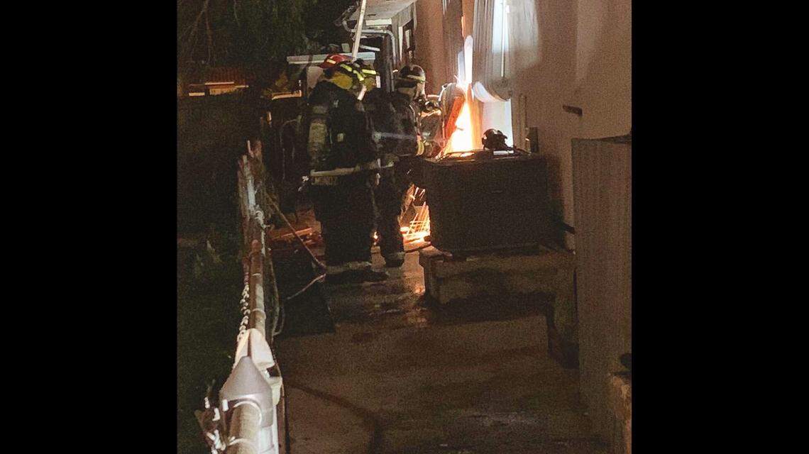 Firefighters work to douse the flames after a home in Hialeah went up in flames.