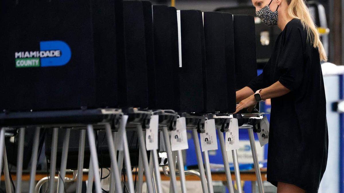A voter cast her ballots during the Miami General Municipal and Special Elections in Miami-Dade County at Miami Beach Fire Department - Station 3 on Tuesday, November 2, 2021 in Miami Beach, Florida.