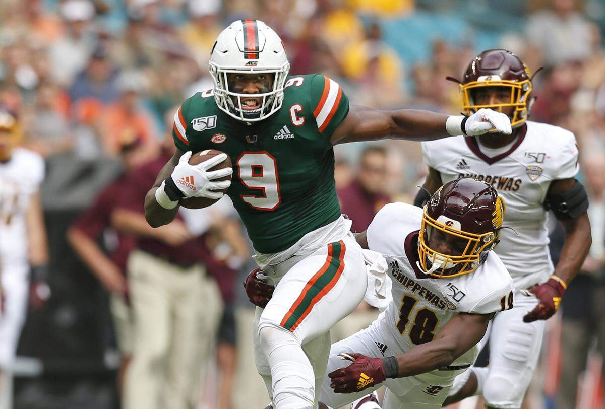 Miami Hurricanes tight end Brevin Jordan (9) runs on a first down pass reception in the first quarter as the University of Miami Hurricanes host the Central Michigan Chippewas at Hard Rock Stadium in Miami Gardens on Saturday, September 21, 2019.