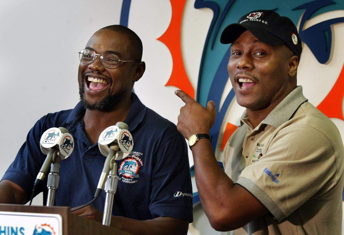 In 2003, the Marks brothers press conference at Dolphins Training camp In Davie announcing their induction into Dolphins Honor Rolll. Here Mark Duper, left, laughs as Mark Clayton relays a story about their exploits together.