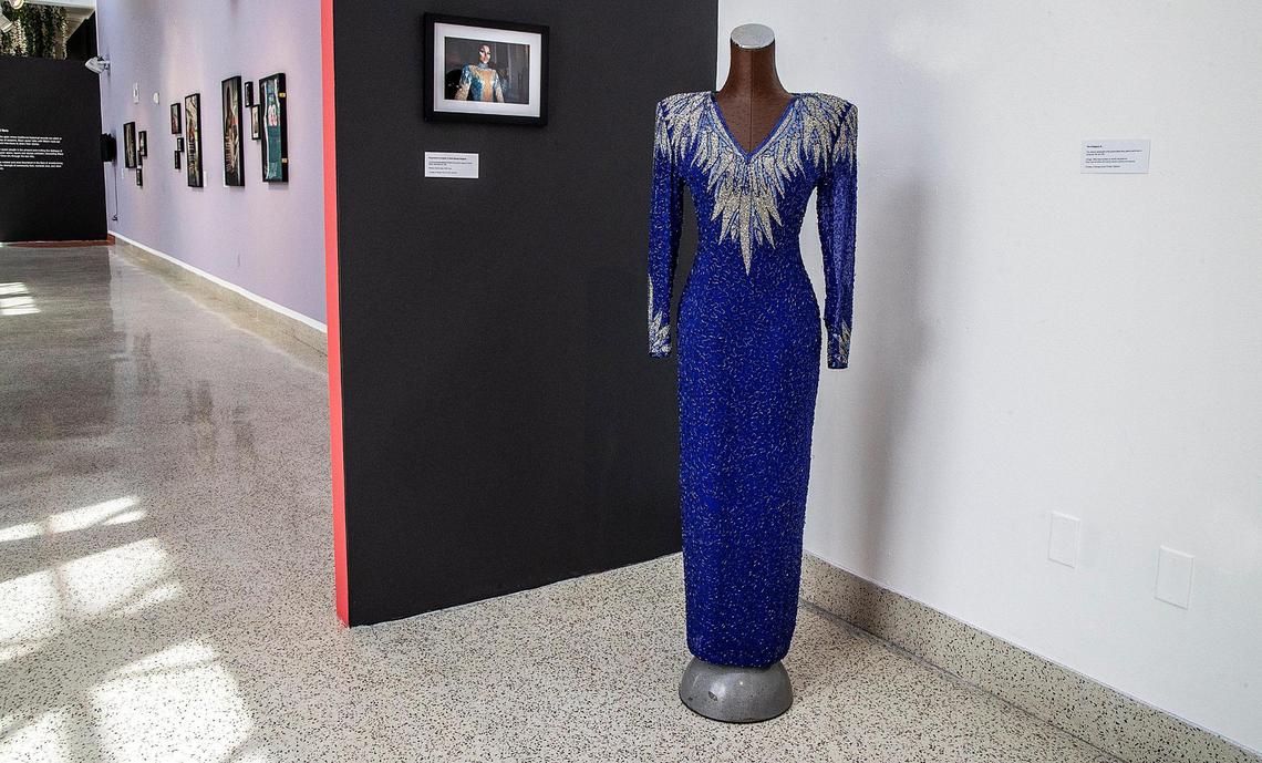 A Vintage 1980s black tie dress by He-Ro industries Inc. from the Nadege Green private collection, part of the exhibit “Give Them Their Flowers:” An Exhibit of Black LGBTQ+ Miami History.“