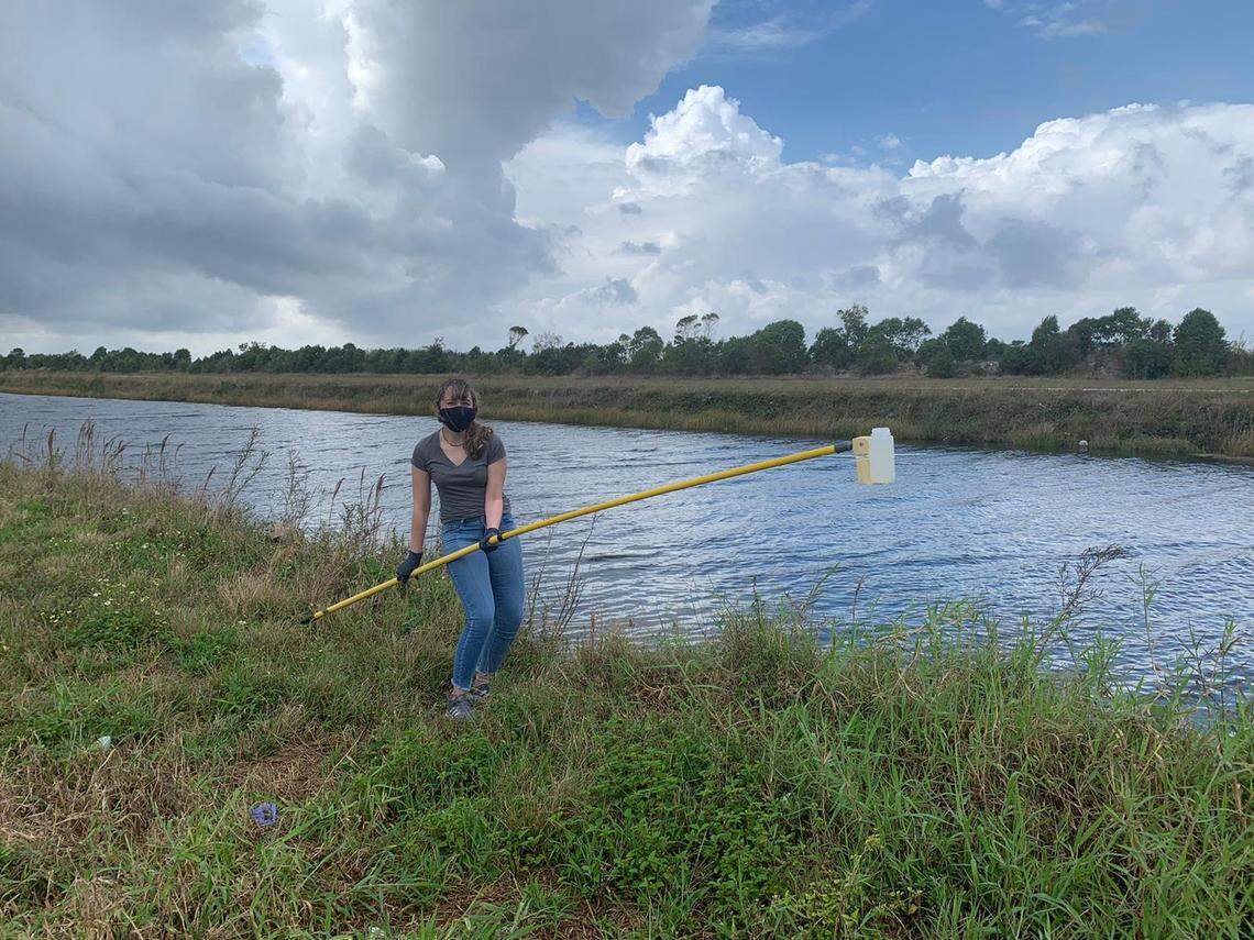 FIU student Morgan Fatowe gathers water samples to test for levels of toxic PFAS chemicals.