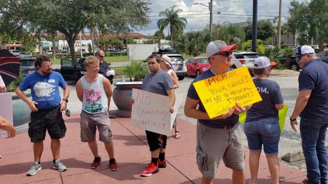 About 50 Disney cast members protested Friday against the company’s vaccination mandate.