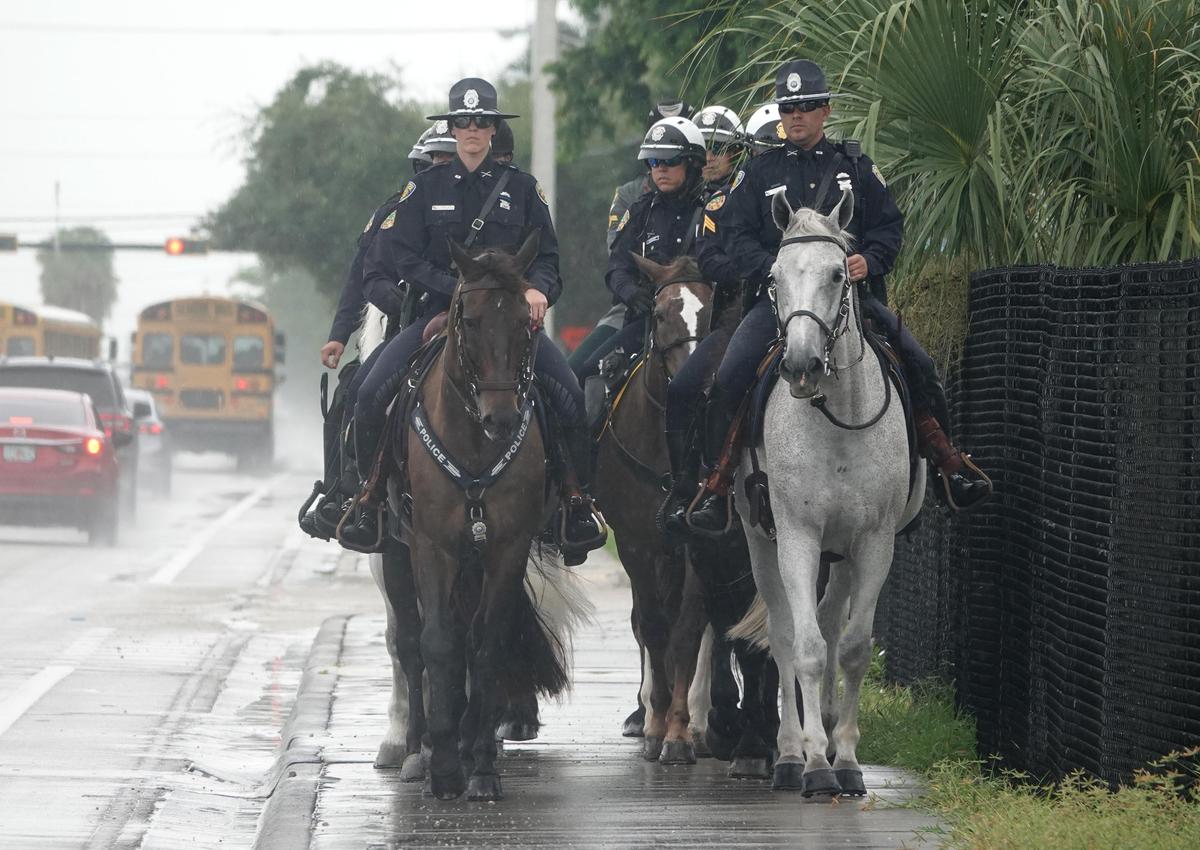The Fort Lauderdale Police Department mounted patrol arrives for the funeral of Broward Sheriff’s Office Deputy Benjamin Nimtz at Calvary Chapel in Fort Lauderdale.