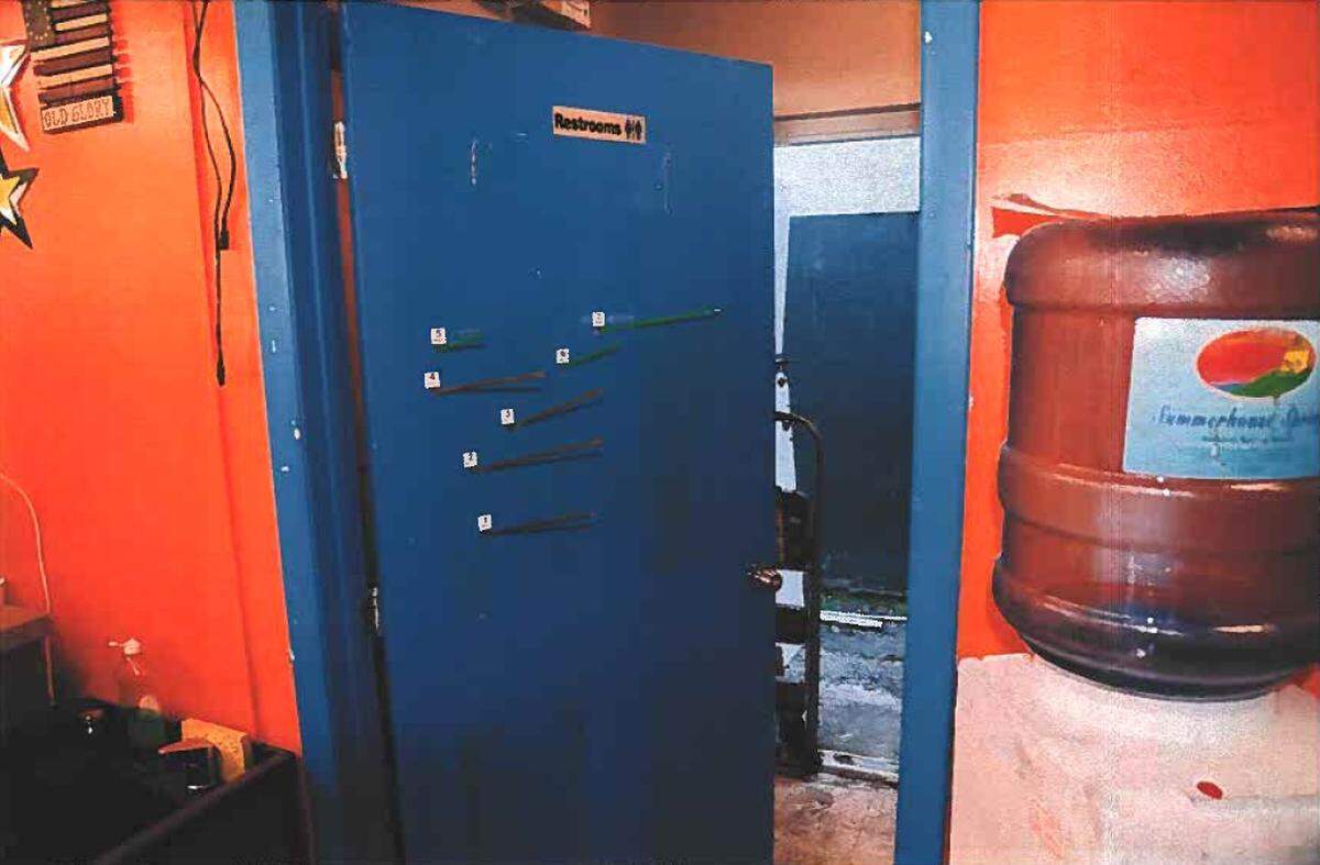 The trajectory of bullets filed through a door inside the Couleur Barbershop in North Miami-Dade in March 2014. A judge this month dismissed the murder charged against the gunman, Garry Garcon, after ruling he acted in self-defense.