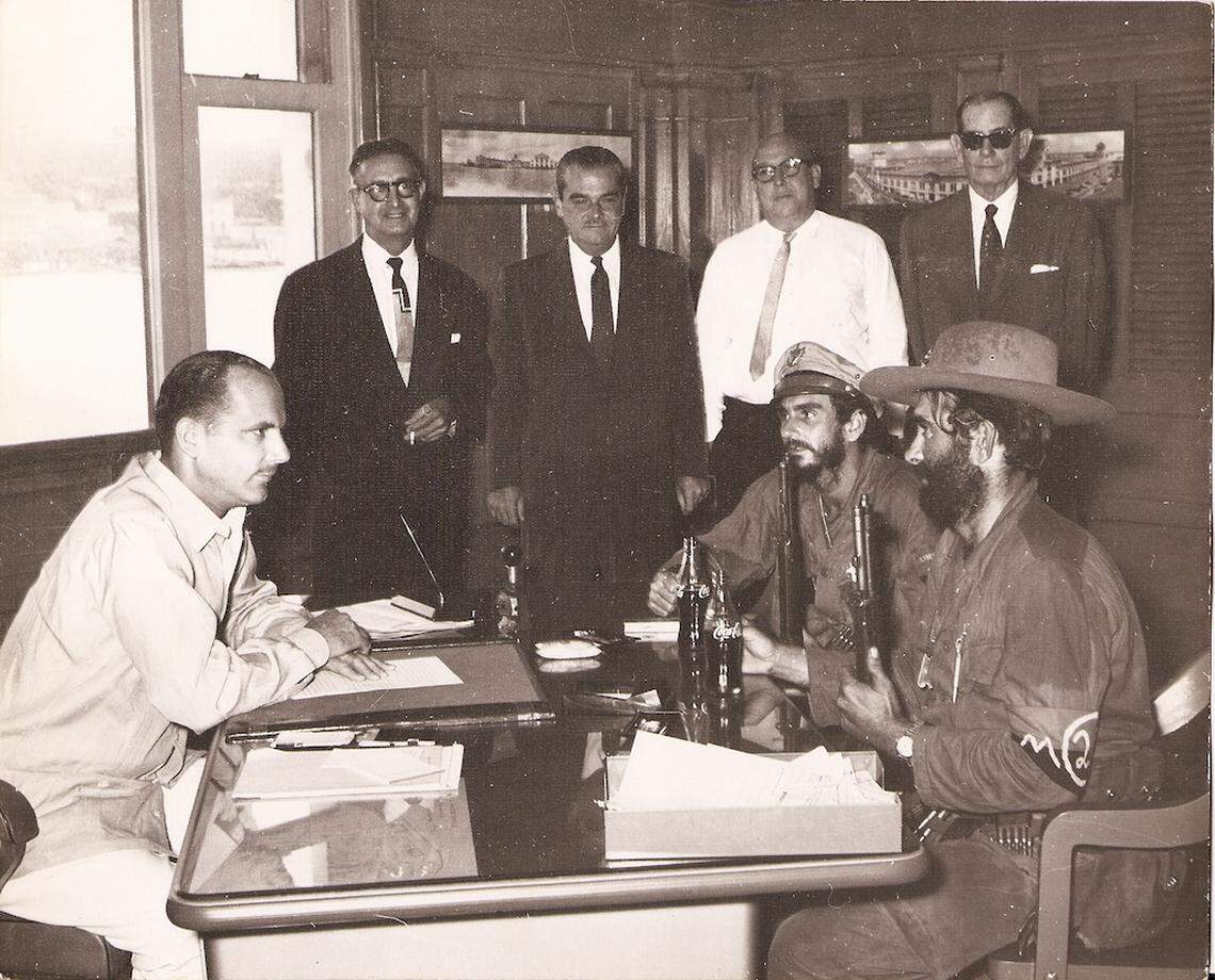 William Behn faces off across a desk with two armed revolutionaries when Havana Docks Corp. was nationalized by the Castro government on Nov. 21, 1960. His grandson, Mickael Behn, inherited the certified claim for the company.