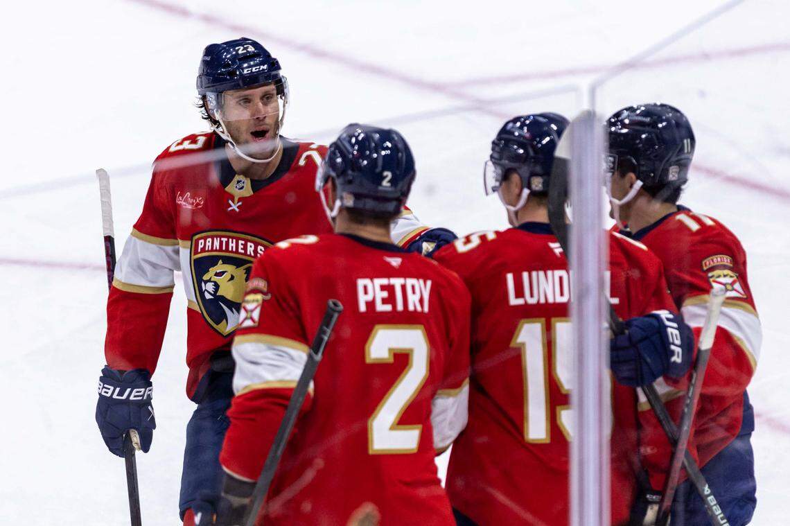 Florida Panthers teammates react to center Anton Lundell (15) scoring on Philadelphia Flyers goaltender Dan Vladar (80) during the second period of an NHL game at Amerant Bank Arena on Thursday, October 9, 2025, in Sunrise, Fla.
