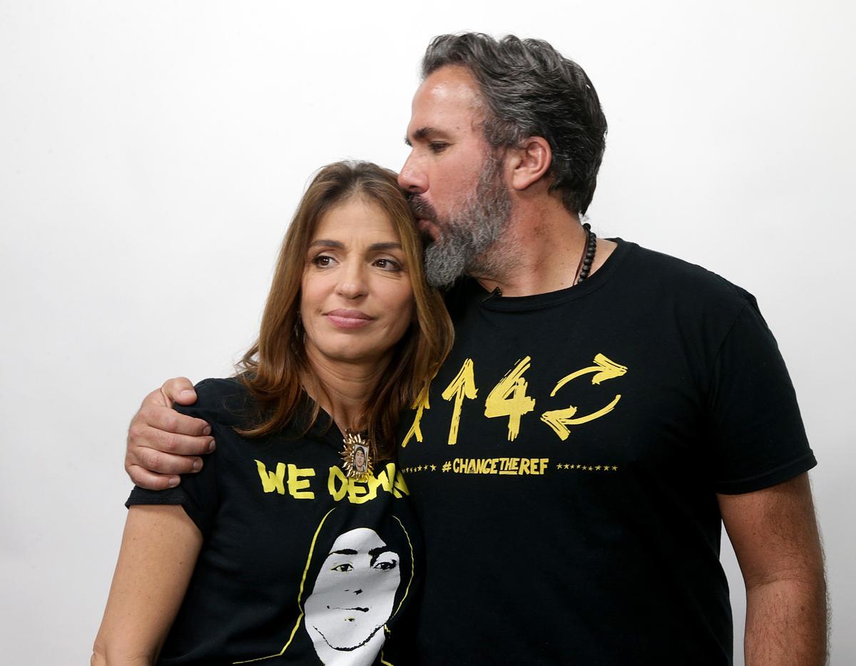 Patricia and Manuel Oliver, parents of 17-year-old Parkland shooting victim Joaquin Oliver, embrace during a press conference in Wynwood in Miami on Tuesday, June 5, 2018.