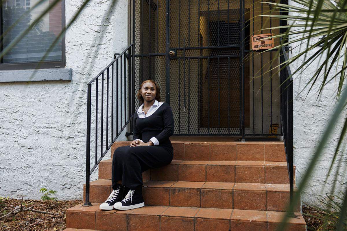 Ifetayo Frye, 19, poses out her apartment building at Casa Valentino, a safe haven home for young people who have found themselves homeless, on Tuesday, Dec. 16, 2025, in Miami, Fla. School was an escape from chaotic home life growing up. “I've always been grateful for anything anybody gives me. I would rather be [in a shelter] then be sleeping outside,” said Frye.