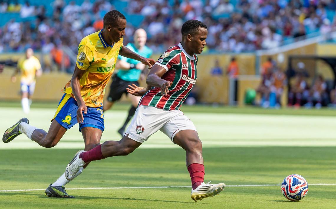 Fluminense FC defender Juan Freytes (22) runs with the ball as Mamelodi Sundowns defender Divine Lunga (29) defends in the second half of their FIFA Club World Cup Group F third-round match at Hard Rock Stadium on Wednesday, June 25, 2025, in Miami Gardens, Fla.