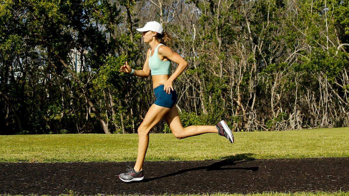 Marathoner Johanna Butler runs in Kennedy Park. Photo by Michael Reeves.