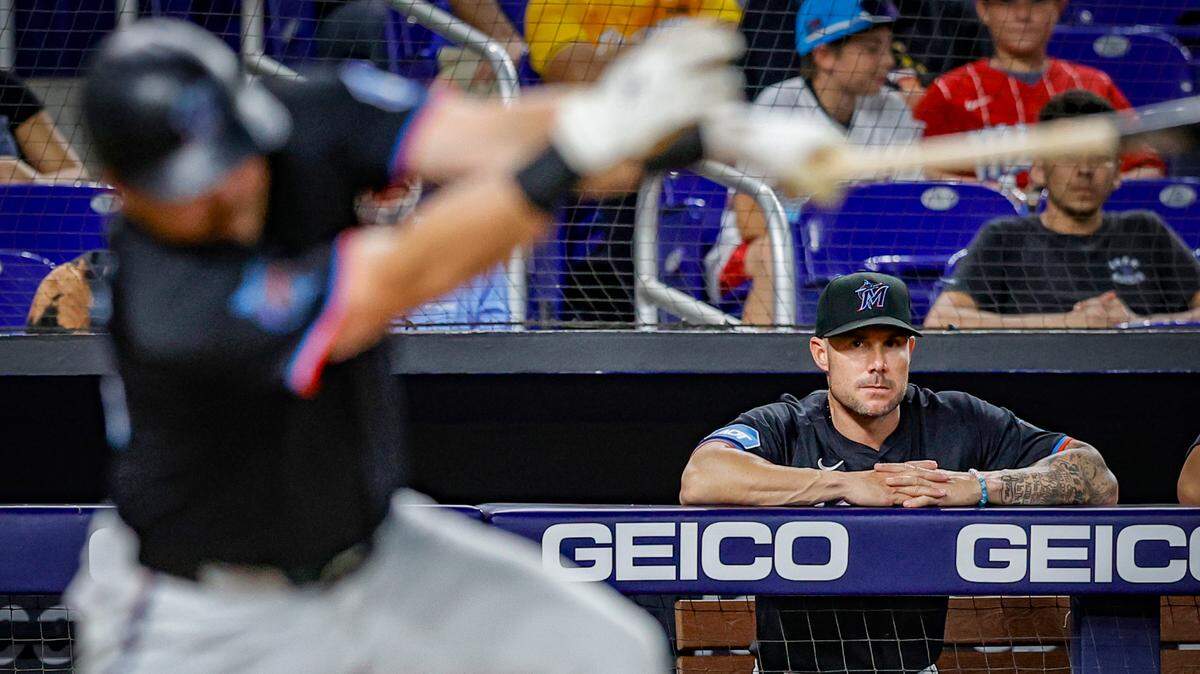 Miami Marlins manager Skip Schumaker (45) watches first baseman Jake Burger (36) at bat during the game against the Atlanta Braves at loanDepot park in Miami, Florida on Friday, April 12, 2024.