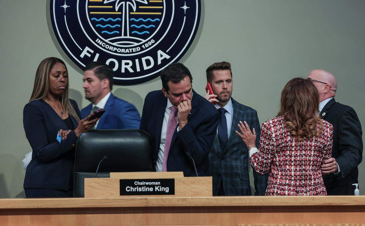 Miami City Commissioners Ralph Rosado (center), Christine King and Damian Pardo (far right), talked to staff members ahead of a Commission meeting to discuss important items including a proposal to donate $7.5 million in city services to the World Cup when the games come to Miami Gardens next year, at City Hall, on Thursday, Nov. 20, 2025.