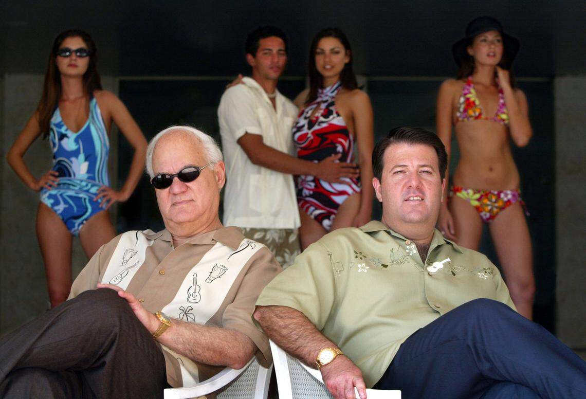 George and Oscar in 2006 posing with models at the Doral Spa and Resort.