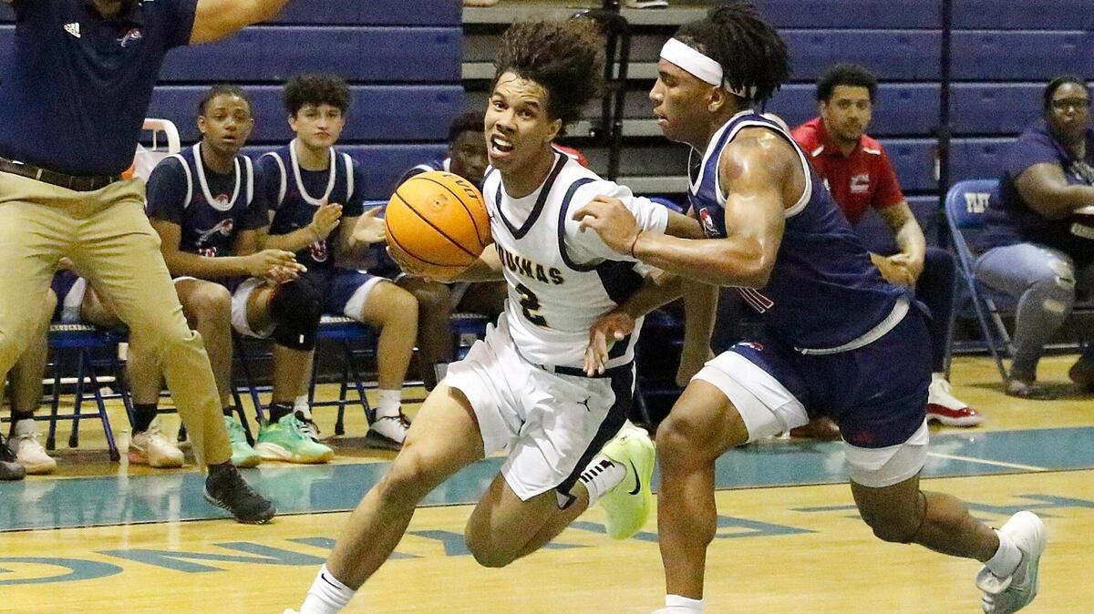 St. Thomas Aquinas Raiders Drake Sandi (2) dribbles toward Chaminade-Madonna Lions basket during 2025 BCAA Big 8 Boy’s Basketball final game Saturday, February 01, 2025 at Fort Lauderdale HS in Fort Lauderdale. Andrew Uloza / for Miami Herald