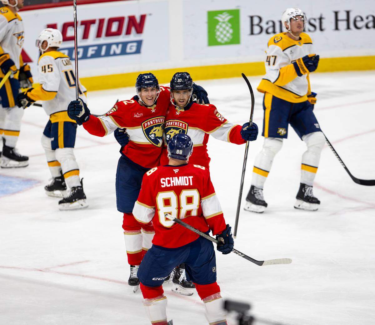 Florida Panthers left wing Tomas Nosek (92) celebrates with teammates A.J. Greer (10) and Nate Schmidt (88) after scoring a goal during the third period of an NHL game against the Nashville Predators at the Amerant Bank Arena on Thursday, Nov. 7, 2024, in Sunrise, Fla.