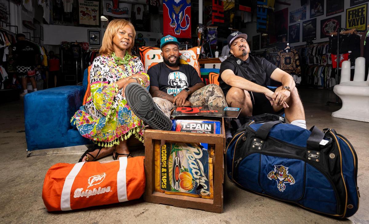 Rapper Greg “King Tetrus” Owens, 36, center, is photographed alongside his mom, Debra Duster Owens, 67, and Manny Fuentes, 47, CEO of Still A Hobby? Ent., at Yesterday Miami on Saturday, May 10, 2025, in Miami.