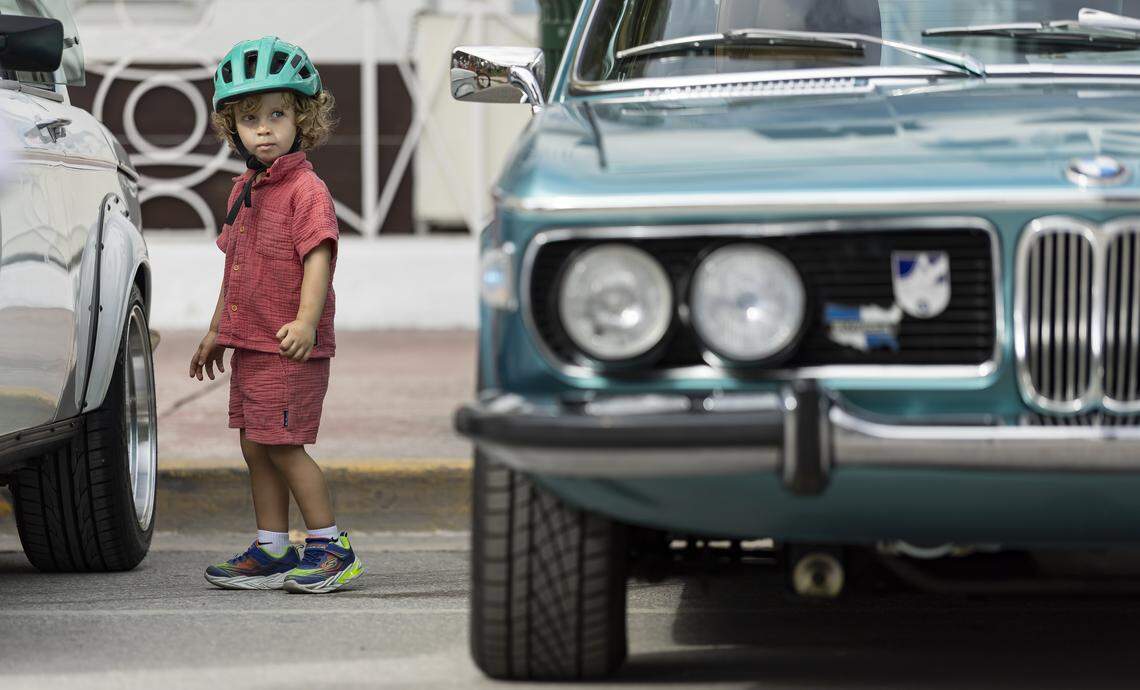 Adam Ukhanov, 2, looks at a 1973 BMW 3.0 CS on display at the Classic Car Show during Art Deco Weekend at Ocean Drive on Saturday, Jan. 10, 2026, in Miami Beach, Fla.