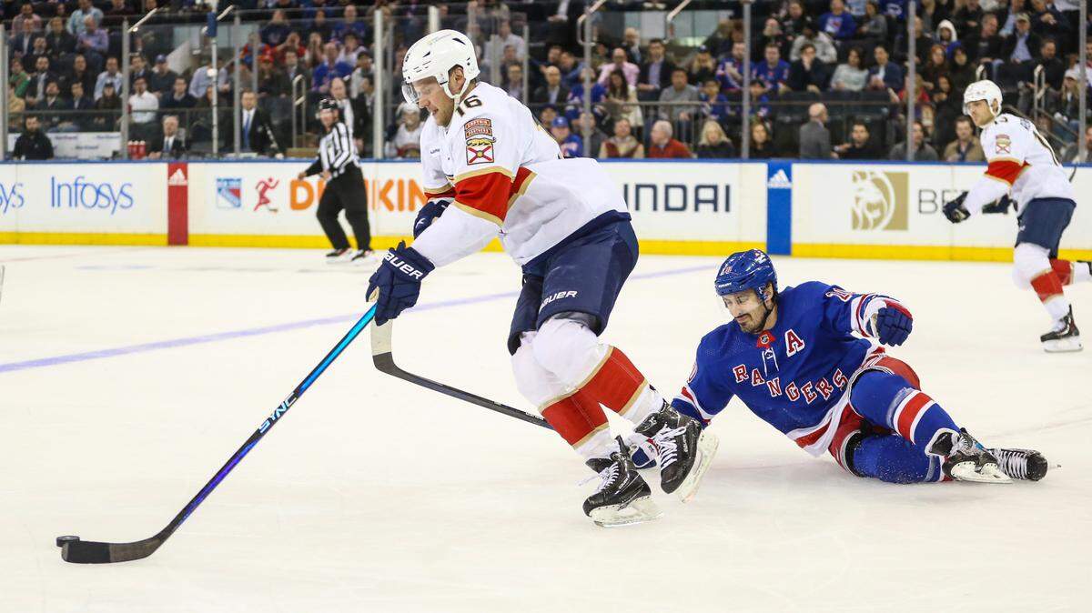 Mar 4, 2024; New York, New York, USA; New York Rangers left wing Chris Kreider (20) falls on the ice chasing after Florida Panthers center Aleksander Barkov (16) in the first period at Madison Square Garden. Mandatory Credit: Wendell Cruz-USA TODAY Sports