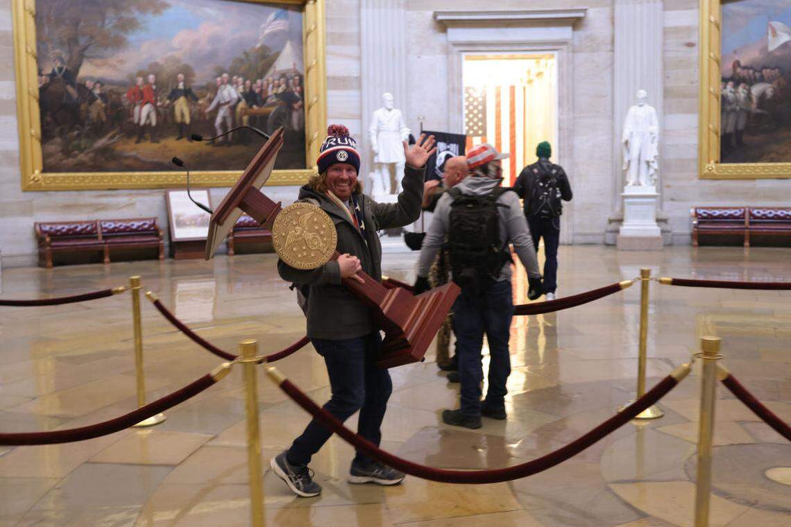 Protesters enter the U.S. Capitol Building on Jan. 6, 2021, in Washington, D.C. Congress was holding a joint session to ratify President-elect Joe Biden’s 306-232 Electoral College win over President Donald Trump. A group of Republican senators said they would reject the Electoral College votes of several states unless Congress appointed a commission to audit the election results.    The FBI is searching for the Florida man identified in a viral photo showing him carrying U.S. Speaker of the House Nancy Pelosi’s lectern as he marauded through the U.S. Capitol during Wednesday’s riot by supporters of President Donald Trump.