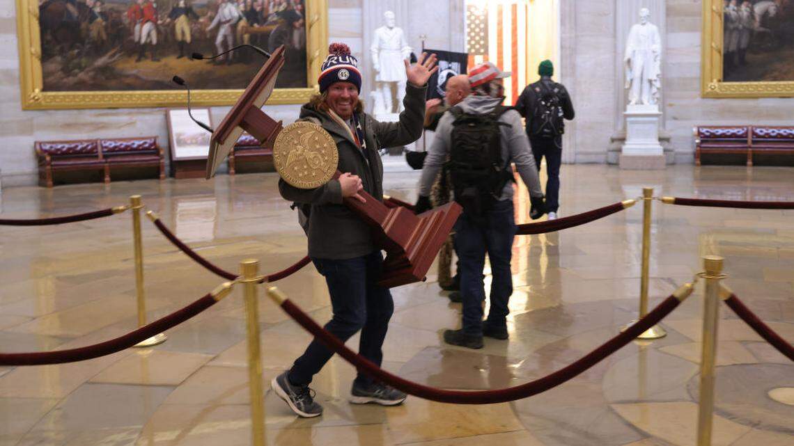Protesters enter the U.S. Capitol Building on Jan. 6, 2021, in Washington, D.C. Congress was holding a joint session to ratify President-elect Joe Biden’s 306-232 Electoral College win over President Donald Trump. A group of Republican senators said they would reject the Electoral College votes of several states unless Congress appointed a commission to audit the election results.    The FBI is searching for the Florida man identified in a viral photo showing him carrying U.S. Speaker of the House Nancy Pelosi’s lectern as he marauded through the U.S. Capitol during Wednesday’s riot by supporters of President Donald Trump.