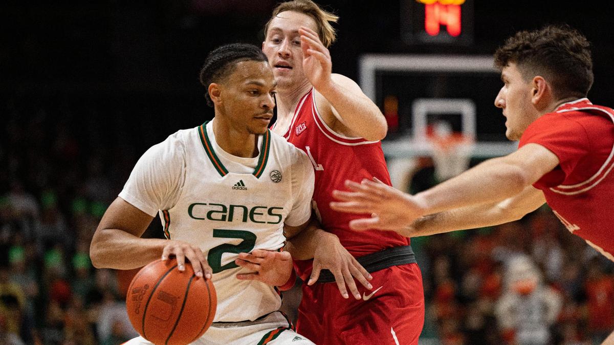 Hurricane’s Isaiah Wong (2) dribbles the ball around Cornell’s’ Max Watson (25) during the first half of a NCAA men’s basketball game between the University of Miami Hurricanes and the Cornell Big Red on Monday, April 25, 2022, in Miami.