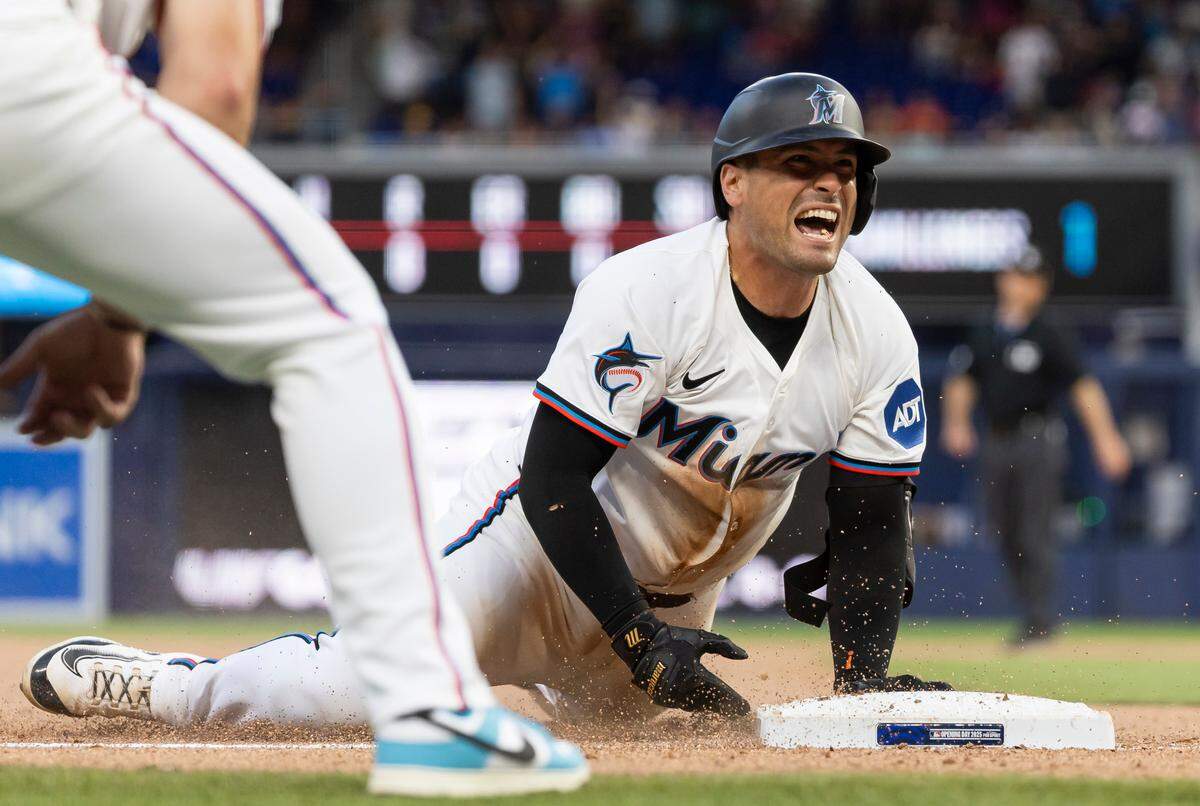 Miami Marlins catcher Nick Fortes (4) reacts after hitting a triple against the Pittsburgh Pirates in the ninth inning of their Opening Day MLB game at loanDepot park on Thursday, March 27, 2025, in Miami, Fla.