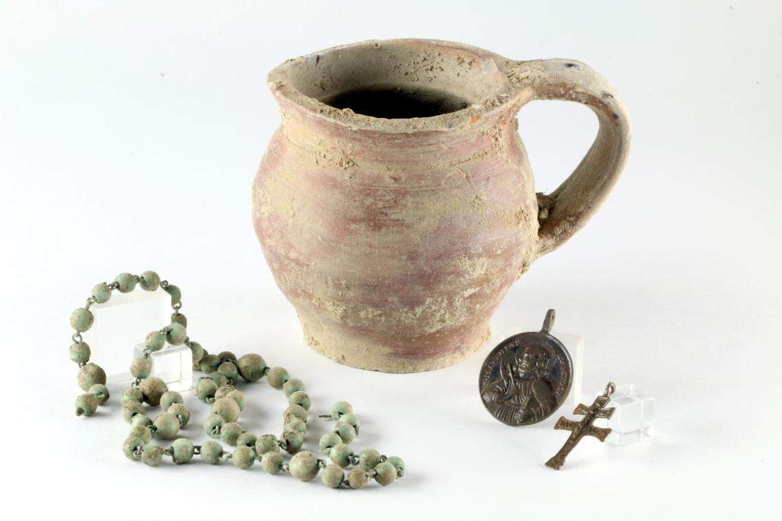 Rosaries, medals and other artifacts were found in the ruins.