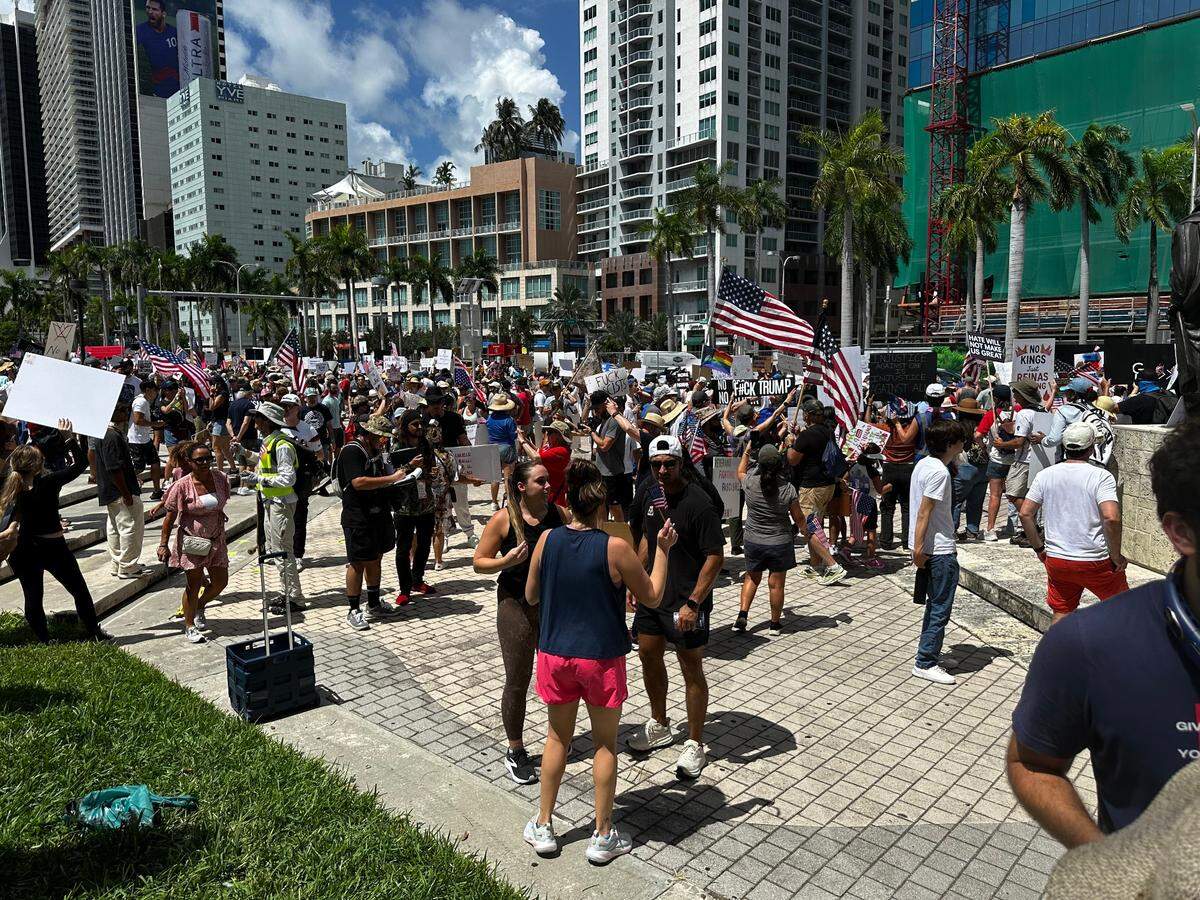 Hundreds gather around the Torch of Friendship in downtown Miami as part of the nationwide “No Kings” protests against the Trump administration on Saturday, June 14, 2025.