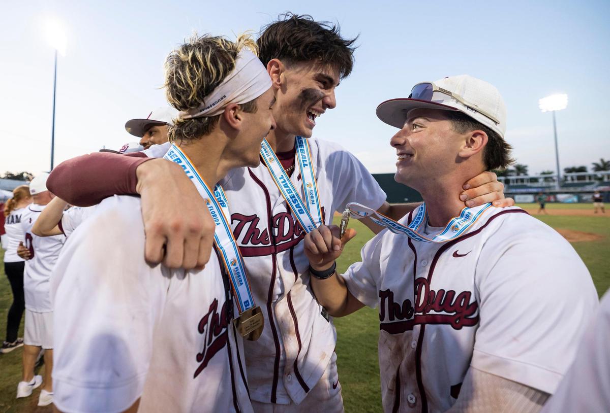 Stoneman Douglas Eagles first baseman Nick Diaz (11) celebrates with his teammates after they defeated the Jupiter Warriors in their Class 7A state baseball championship game at Hammond Stadium on Saturday, May 17, 2025, in Fort Myers, Fla.
