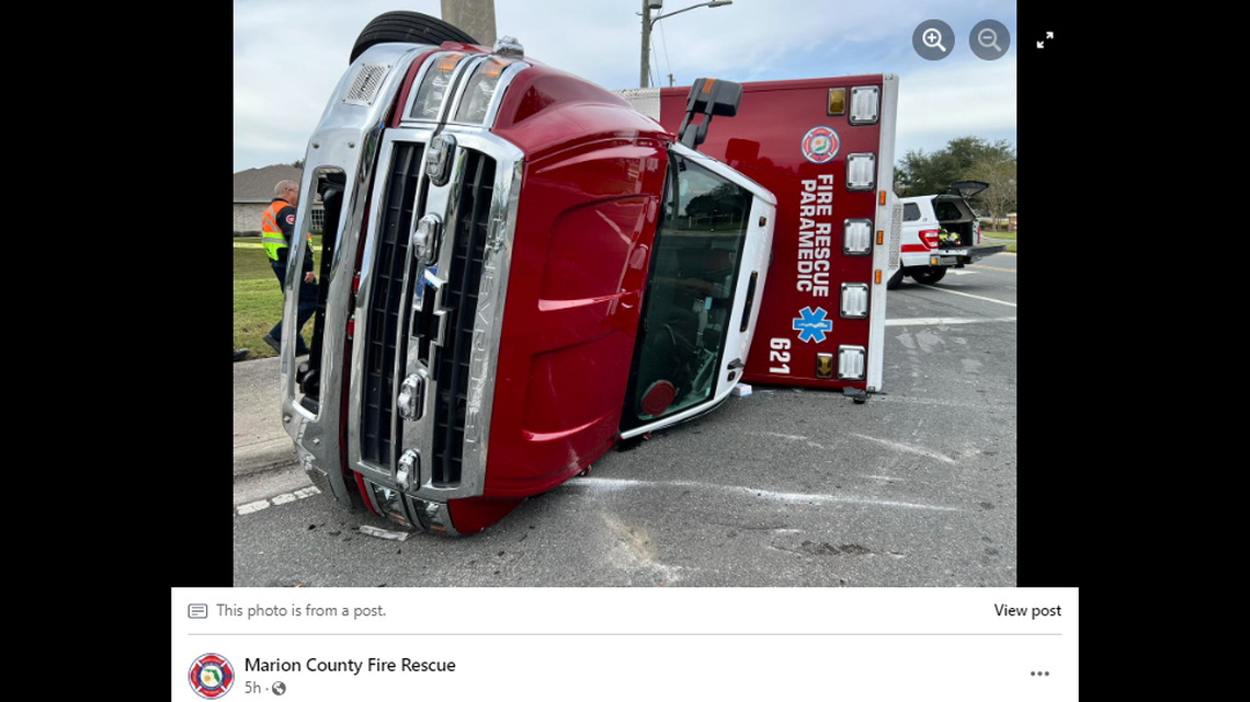The force of the crash knocked the emergency vehicle onto its side.