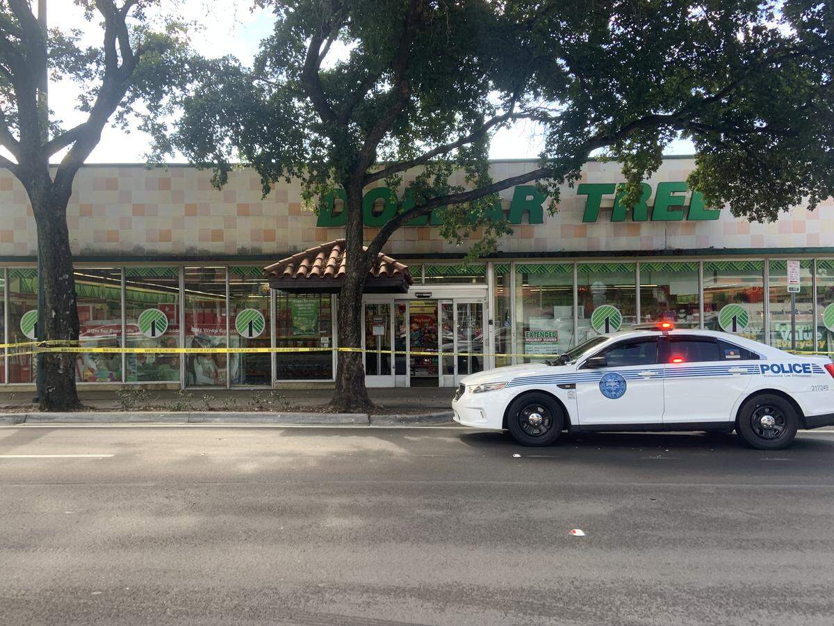 Crime scene tape and a Miami police car are in front of the Dollar Tree store at 968 SW Eighth St. in Little Havana on Sunday morning, Dec. 14, 2025. A woman’s body was found in the freezer Sunday morning, police say.
