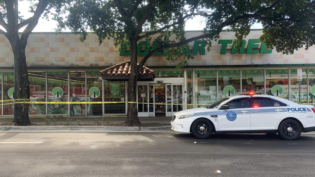 Crime scene tape and a Miami police car are in front of the Dollar Tree store at 968 SW Eighth St. in Little Havana on Sunday morning, Dec. 14, 2025. A woman’s body was  found in the freezer on Sunday morning, police say.