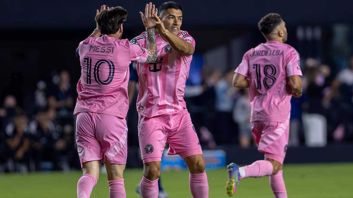 Inter Miami forwards Lionel Messi (10) and Luis Suárez (9) celebrate after teammate Jordi Alba (18) scored a goal during the first half of their Concacaf Champions Cup Semifinal match against the Vancouver Whitecaps at Chase Stadium on Wednesday, April 30, 2025, in Fort Lauderdale, Fla.