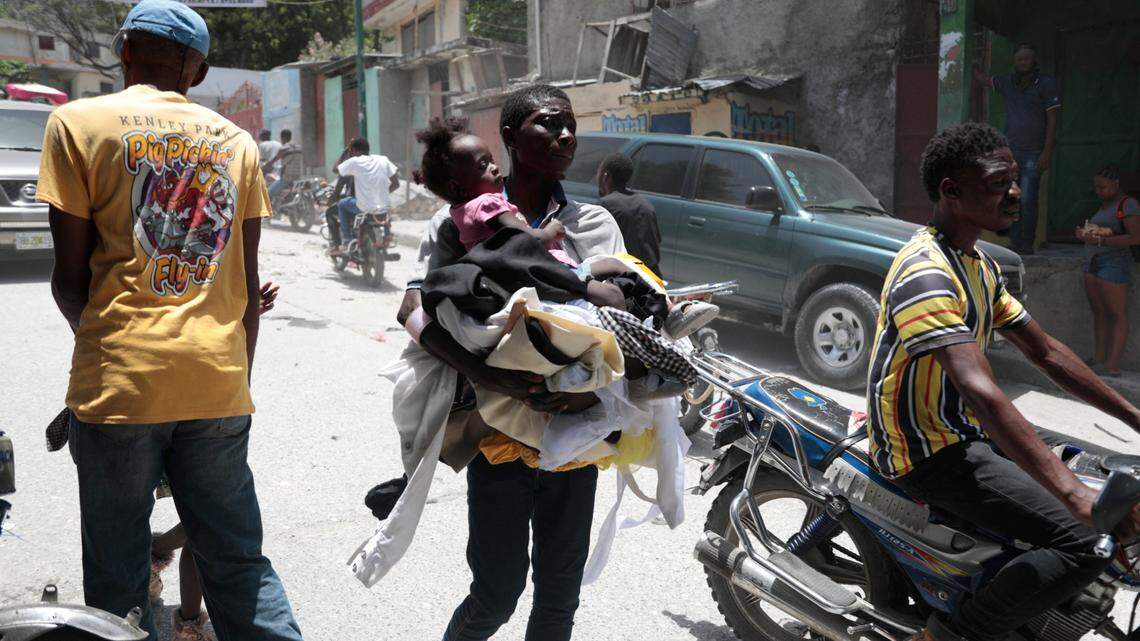 Residents flee their homes to escape clashes between armed gangs in the Carrefour-Feuilles district of Port-au-Prince, Haiti, Tuesday, Aug. 15, 2023.