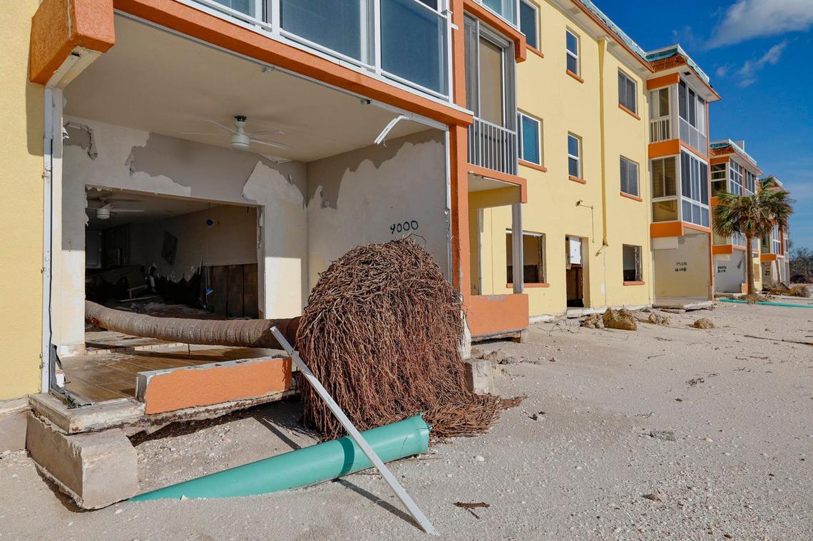 Storm surge and wind from hurricanes Helene and Milton caused beach erosion and damaged condos at Fisherman’s Cove beach front condominium rentals on Siesta Key, Florida on Thursday, October 10, 2024.