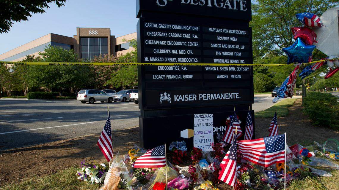A makeshift memorial is seen at the scene outside the office building housing The Capital Gazette newspaper in Annapolis, Md., Sunday, July 1, 2018. Prosecutors say 38-year-old Jarrod W. Ramos opened fire Thursday in the Capital Gazette newsroom killing five journalist. (AP Photo/Jose Luis Magana)