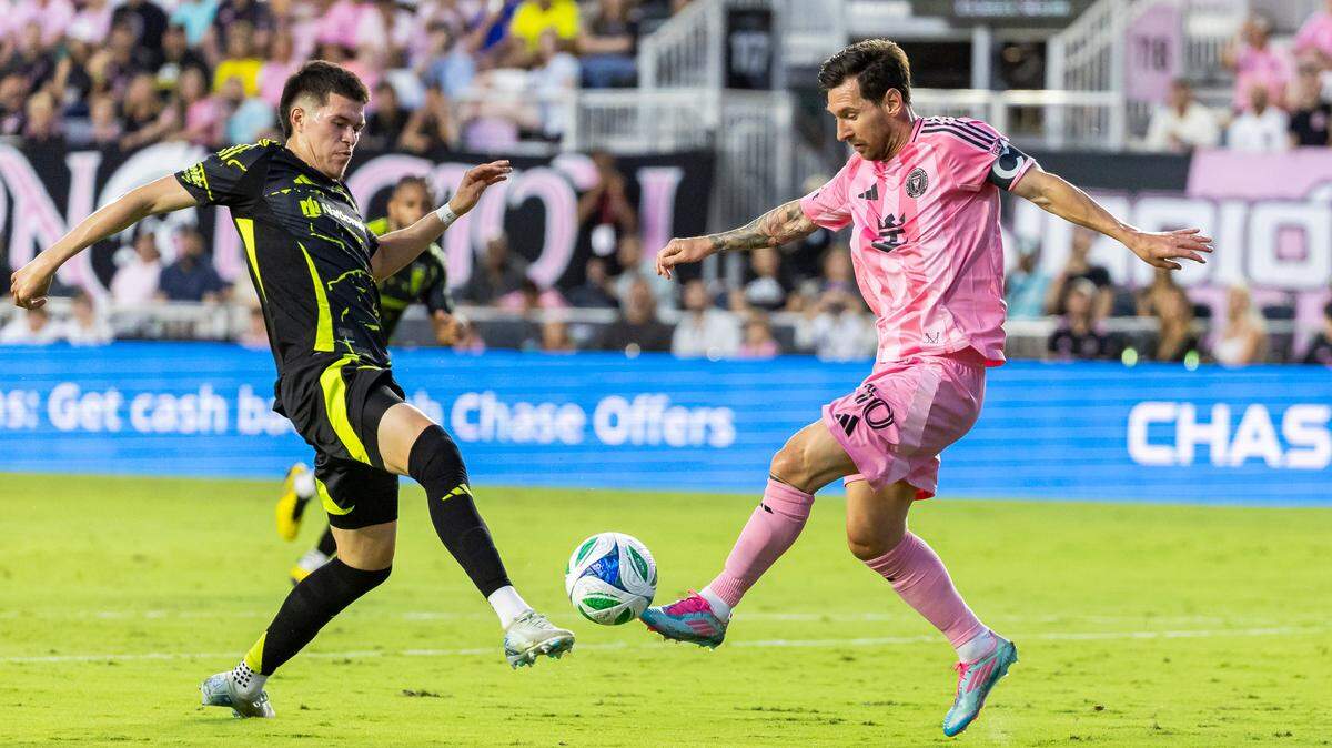 Inter Miami forward Lionel Messi (10) and Columbus Crew defender Cesar Ruvalcaba (48) compete for the ball in the first half of their MLS match at Chase Stadium on Saturday, May 31, 2025, in Fort Lauderdale, Fla.