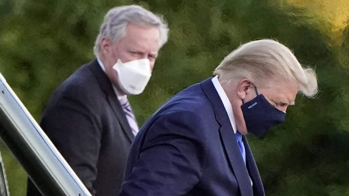 President Trump heads to the helicopter that will take him to Walter Reed medical center after he was diagnosed with COVID-19.